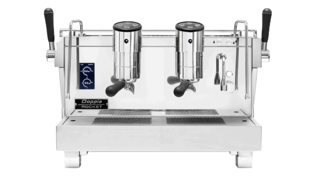 Treehouse coffee. A sleek, stainless steel commercial espresso machine with a modern design. It features two group heads, dual steam wands, and electronic controls, labeled Doppia ROCKET on the front.
