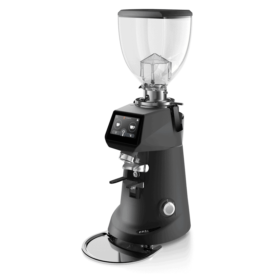 Treehouse coffee. A sleek, modern coffee grinder with a transparent bean hopper on top and a digital display on the front. The grinder has a black body with silver accents and a chrome drip tray at the bottom.