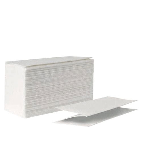 A stack of paper z folded hand towels sits alone, with one unfolded hand towel in front of the stack to show the z fold.