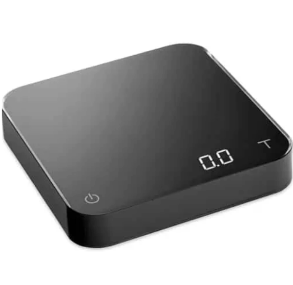 Badger and Dodo Coffee Roasters: The Acaia Pearl - Black (2021) digital kitchen scale has a sleek, modern design with elegantly rounded edges and a clear LED display reading 0.0. It features a power button in the lower left corner.