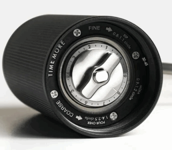 Badger & Dodo. The Timemore Grinder Chestnut espresso is a sleek black manual coffee grinder with clearly marked grind size settings on its adjustment dial.