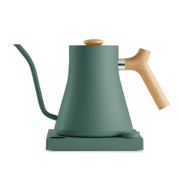 Modern electric gooseneck kettle in matte green with a natural wood handle and knob, placed on a matching green base.