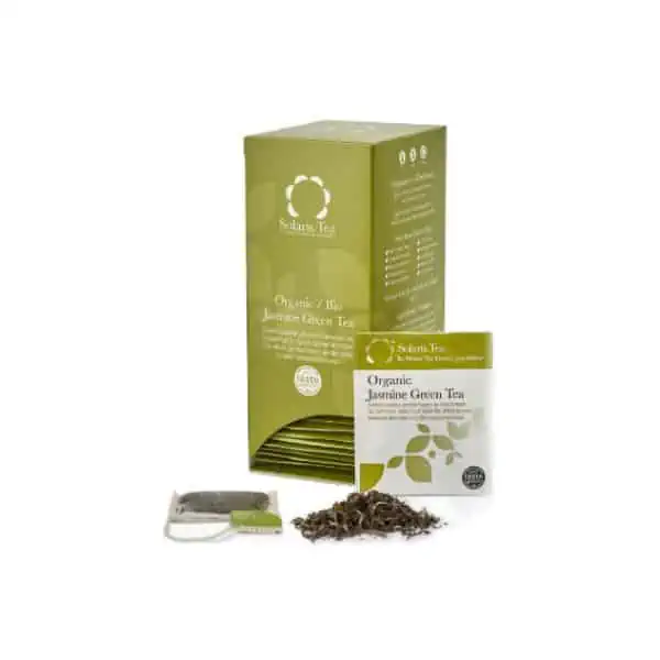 Badger and Dodo Coffee Roasters: A green box of Solaris Jasmine Green organic tea is displayed alongside a tea bag and loose leaves. The box features white and dark green text, while the tea bag is branded similarly and labeled Organic Jasmine Green Tea.