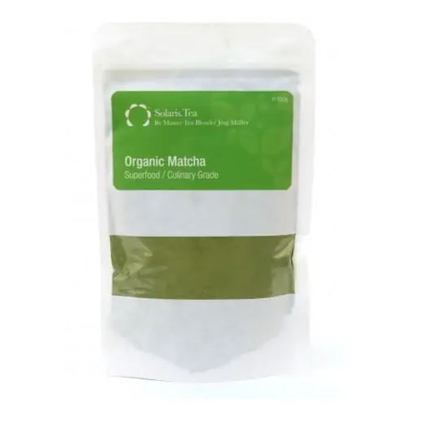 Badger and Dodo Coffee Roasters: A white package of Solaris Tea Green Matcha 100g is displayed, with a green label denoting it as a superfood and culinary grade.