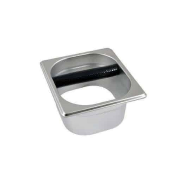 Badger and Dodo Coffee Roasters: The Open Knock Out Box is a square, stainless steel container featuring a circular opening and a black rod in the middle, ideal for disposing of used coffee grounds.
