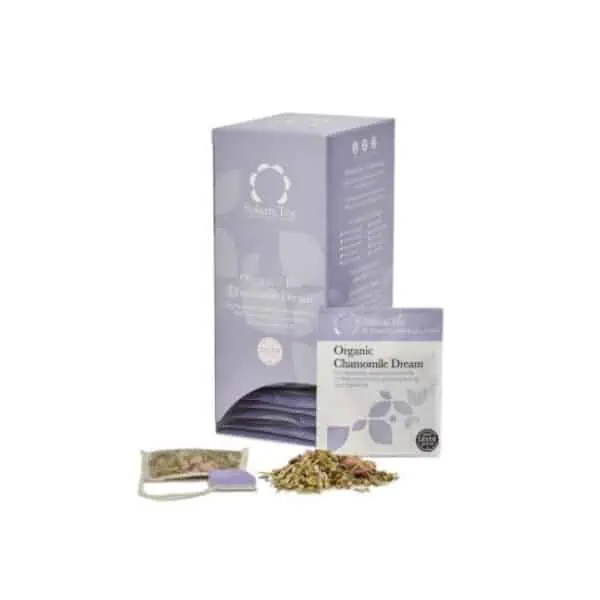 Badger and Dodo Coffee Roasters: A box labeled Organic Chamomile Dream tea is shown alongside an individual tea packet and an opened tea bag, with loose chamomile leaves spilling out. The Solaris-styled box features a subtle leaf design, enhancing its dreamy aesthetic.
