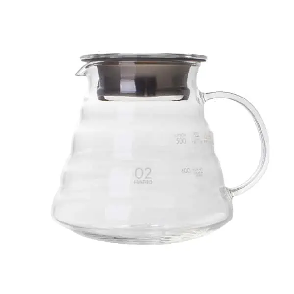 Badger and Dodo Coffee Roasters: The Hario V60 Range Server is made of clear glass with capacity markings, featuring a wide base, curved handle, and a stainless steel lid. Its modern minimalist design suits brewing and serving coffee or tea.