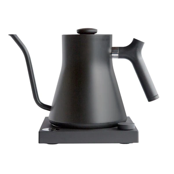 Badger & Dodo. The FELLOW STAGG EKG Electric Pouring Kettle in matte black features a wide base, curved gooseneck spout, and ergonomic handle for precise pouring and modern style.