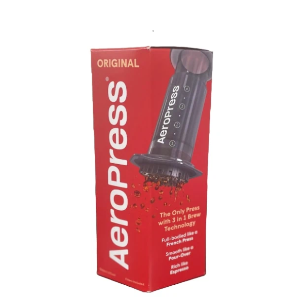 Badger & Dodo. Red Aeropress Starter Kit box displays the coffee maker in use, labeled “Original” with key features highlighted. Ideal for new Aeropress users.