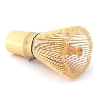 Badger & Dodo. The Matcha Whisk, made from bamboo, rests on its side against a white background.