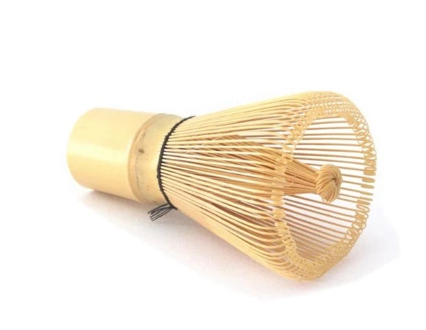 Badger & Dodo. The Matcha Whisk, made from bamboo, rests on its side against a white background.